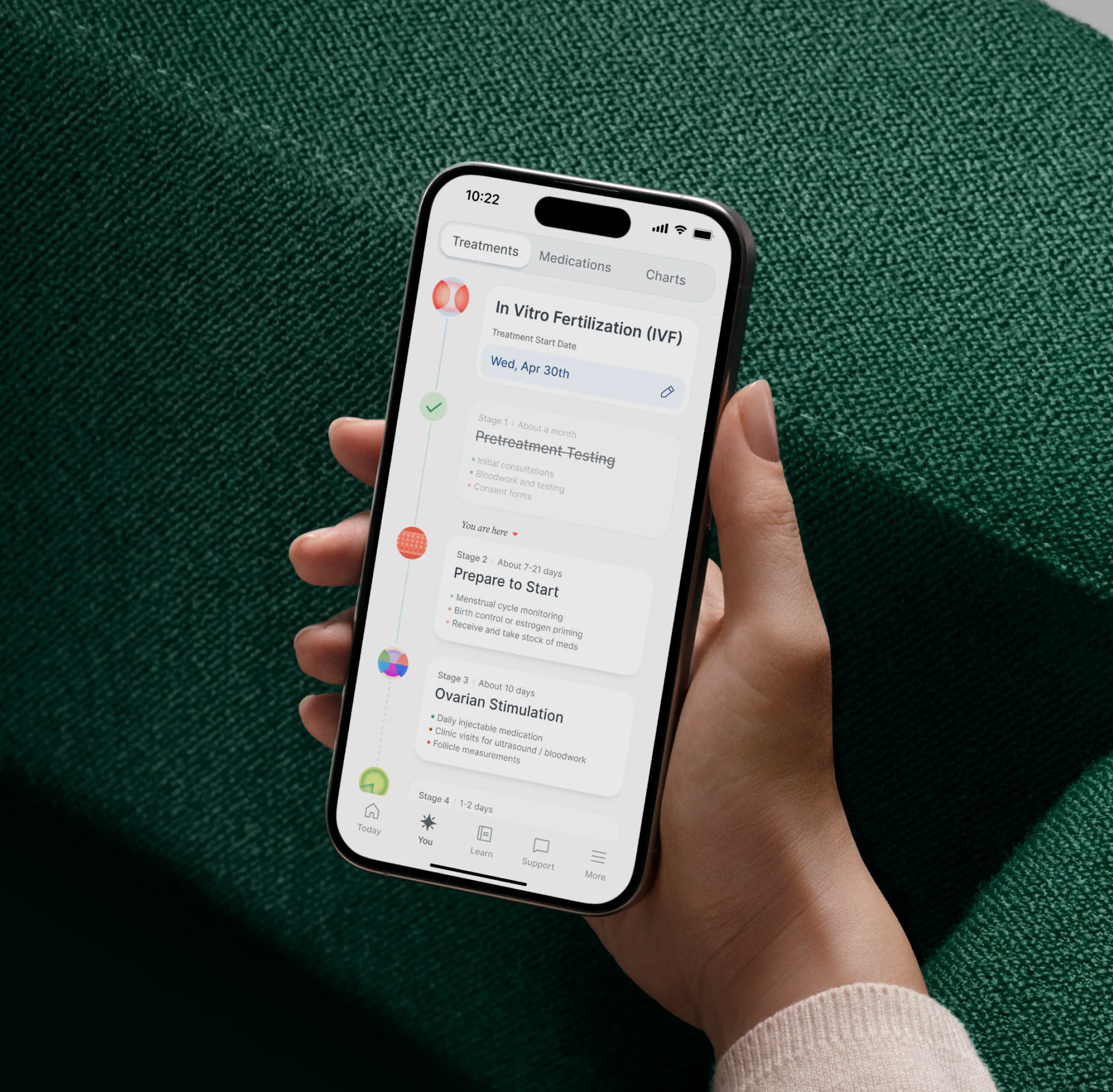 A patient holding a phone with the Berry treatment timeline open