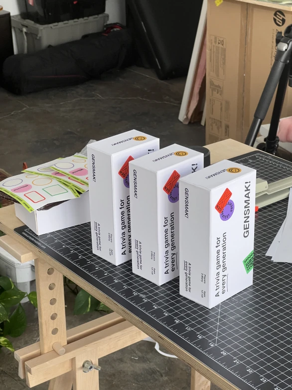 Finished GENSMAK! game boxes ready to ship