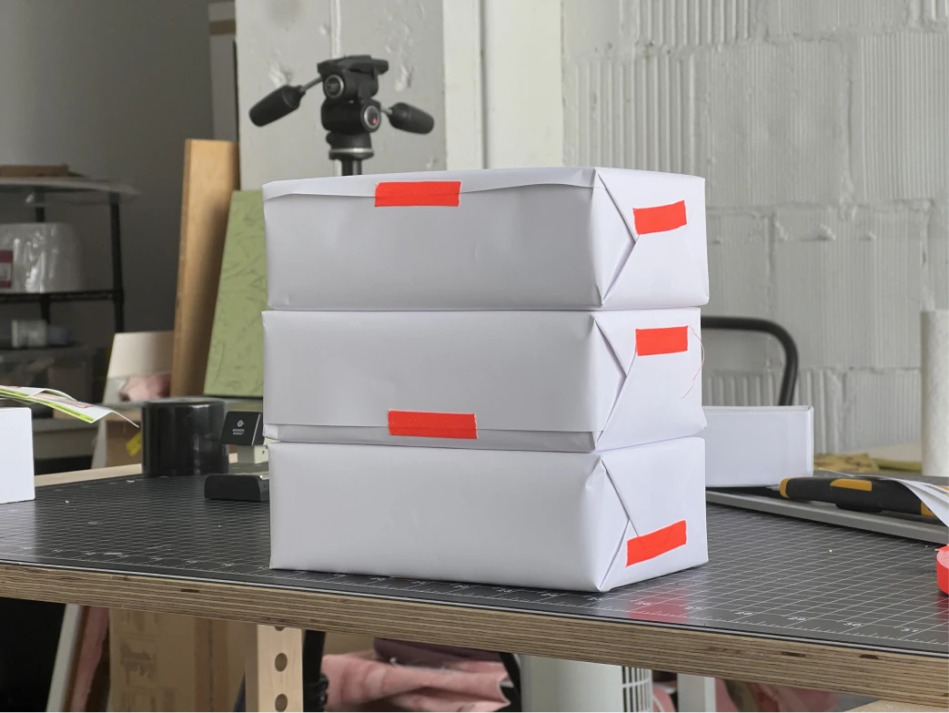 Stacks of Sandwich Shop Games shipping boxes